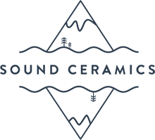 Sound Ceramics logo with illustrated snow-capped mountains, evergreen trees, and water above the text and mirrored below the text.
